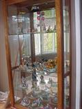 lovely curio cabinet loaded with artist Ron Lee sculptures, many limited editions!