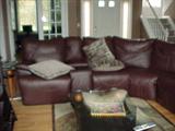 new in May 09 custom leather sectional which reclines