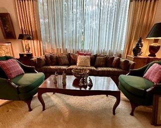 Living room with sofa, arms chairs, coffee table and collectable art.  Arm chairs and coffee table sold.