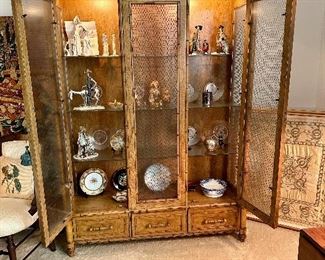 Display cabinet from Century holding nice collectable art.  Century display cabinet sold.