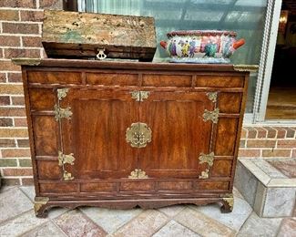 Two door Asian inspired Henredon cabinet supports a wooden box with red crested crane and a foot bath.  Box and foot bath sold. 