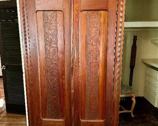 Antique armoire with beautiful wood work.