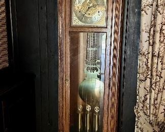 Howard Miller grandfather clock with moon phase dial.
