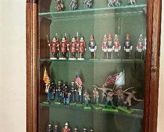 Display of miniature toy soldiers.