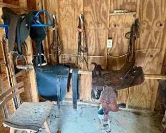 Saddles and horse-riding gear.  Sold