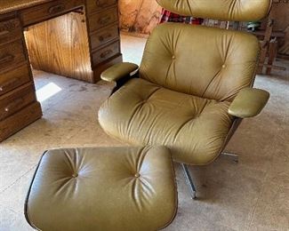 Mid-Century Eames chair and ottoman along side an oak roll-top desk.  Sold. 