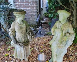 Concrete European couple yard art 