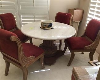 Round Marble Top on Pedestal Base with 4 cranberry upholstered chairs.  Excellent Condition.