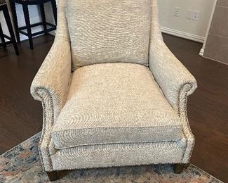 Upholstered chair with nail head trim