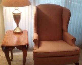 Clayton Morris Wingback Chair, Wooden End Table and a Nickel Finish Lamp https://ctbids.com/estate-sale/18696/item/1889287