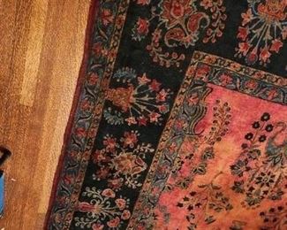 One of many beautiful antique persian style rugs