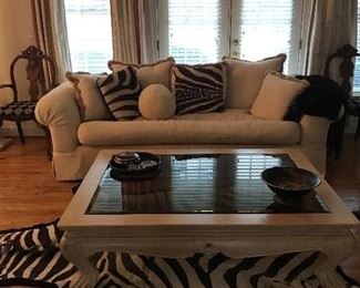 Genuine zebra skin rug, large glass inset coffee table