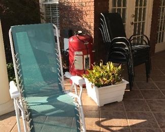 Pair of lounge chairs, grill, stacking outdoor chairs, planter