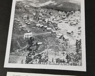 Old photos of Colorado in large scrapbook 