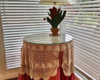 Round Table, green Formica top underneath the glass and lace