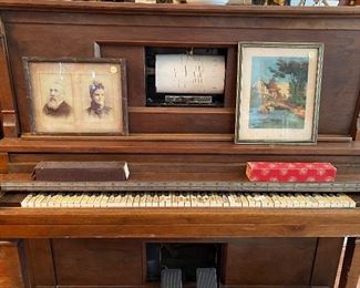 Player piano complete with over one hundred music rolls 