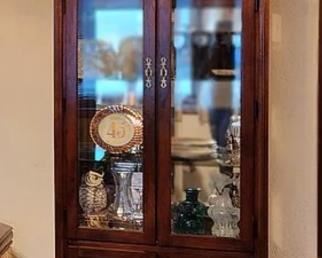 Curio cabinet with glassware