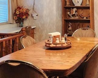 Nice dining table with 6 comfortable chairs that rock and swivel and roll!   Very good condition 