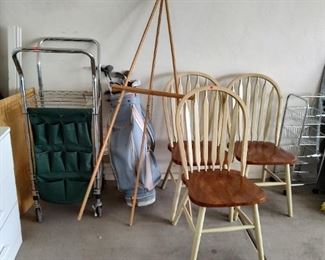 Wooden kitchen chairs, golf clubs, portable storage bin