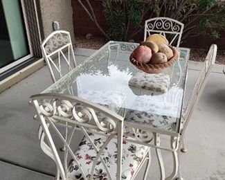 Metal and glass outdoor table with matching chairs