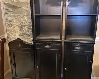 #10(3) black cabinets with 1 door, 1 drawer, pull out shelf and open self. 18x14x69 each $75 for all 3