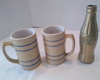 Early restaurant mugs and gold Coke bottle display