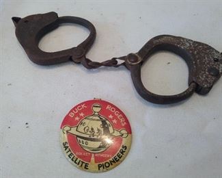Buck Rogers souvenir button and child's handcuffs