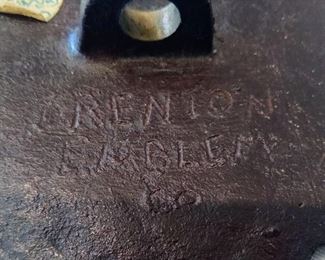 Maker's Mark on the back of brass marker
