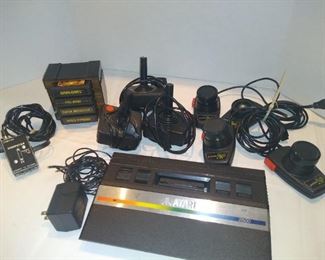 Vintage Atari game with controllers and games 