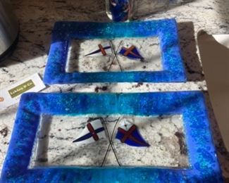 Pair of Marblehead glass burgee flag trays with largest measuring 17” x 9”.