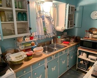 Sweet little kitchen full of kitchenwares and cookware