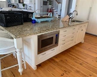 Kitchen island close-up. Appliances are not for sale. Granite is not included. 