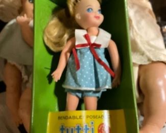 Tutti doll with extra clothing