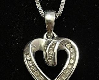 10K WG heart pendant w/ diamonds with a 14K gold chain.