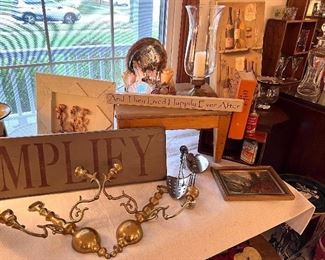 Brass candle sconce
Signs
Glass and silver candle holder
