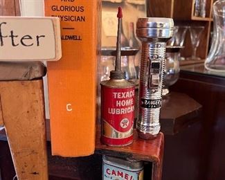 Antique cans - Texaco oil can, Camel repair kit can,  and Ranger flash light