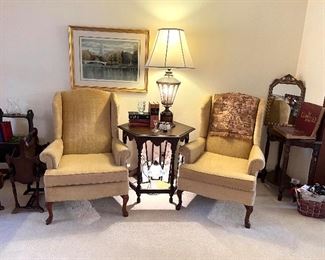 Matching gold tone wing back chairs 
Octagon side table
Antique table lamp
