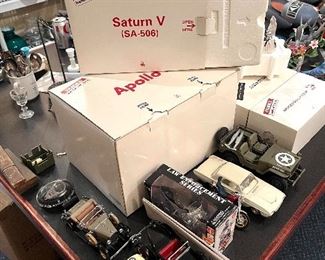 And assortment of collectible cars and a Franklin Mint Saturn V
