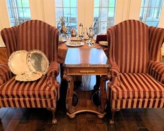 Classic wing chairs separated by a game table.  Interior of game table has a backgammon / chess board and playing pieces.  