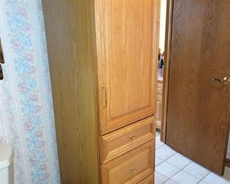Tall bathroom linen floor cabinet with drawers 