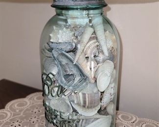 Large blue Ball jar filled with shells lamp