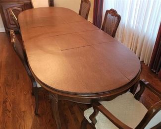 Davis Cabinet Co. Dining table with six chairs and padding