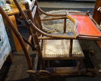 Antique High Chair that coverts down to stroller.