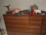 There is a full wall of these teak dressers, multiple uses for storage and in great condition