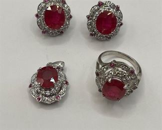 
Luxurious blood red ruby main stone and sapphire sterling set ring pendant and two matching earrings