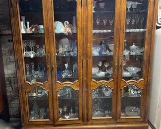 Henrendon lighted hutch filled with beautiful glassware