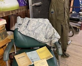 Barbershop chair and some military items.