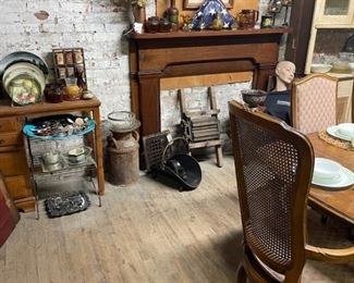 Framed art, platters and collection plates. The mantle is even for sale!