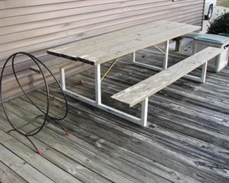 log rack, picnic table, hose reel