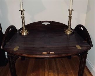 Butler table with pair of brass candlestick lamps